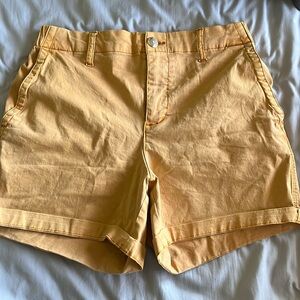 yellowish orange jean shorts